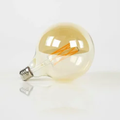 WoonStijl Lichtbron LED filament bol Ø12 5 - E27 6W 2100K 450lm dimbaar / Amberkleurig glas