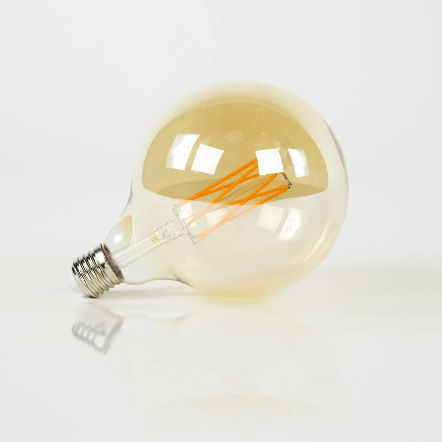 WoonStijl Lichtbron LED filament bol Ø12 5 - E27 6W 2100K 450lm dimbaar / Amberkleurig glas